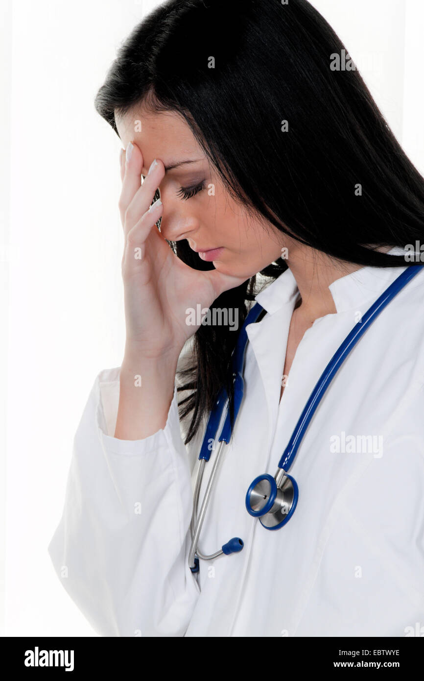 Overburdened doctor at the hospital under stress Stock Photo