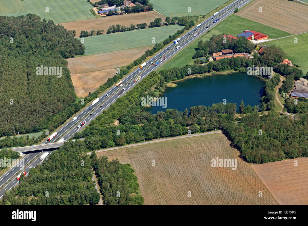 quarry pond at highway A 1 near Holdorf, Germany, Lower Saxony Stock Photo