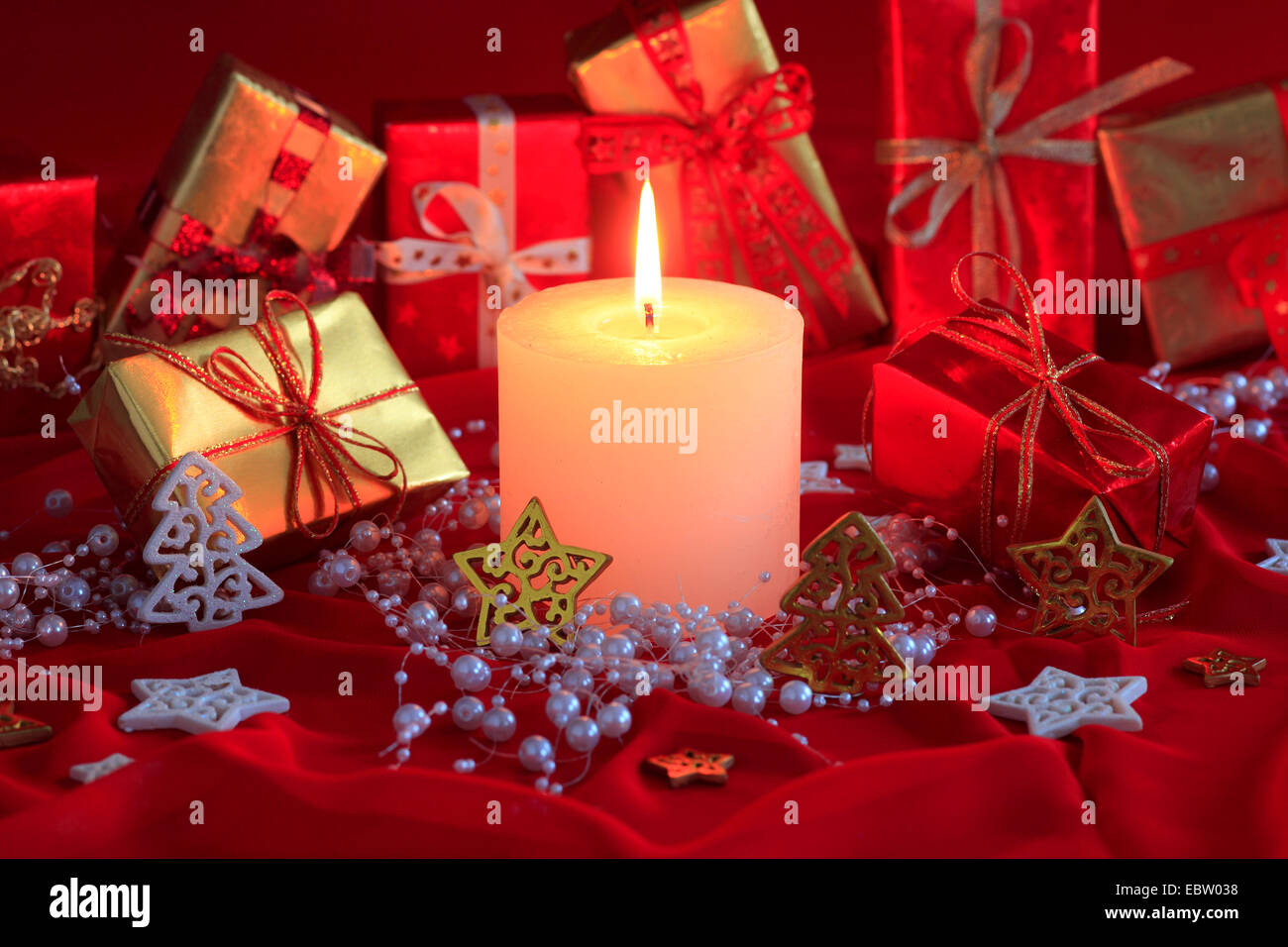 Christmas decoration with presentation packs and candle Stock Photo - Alamy