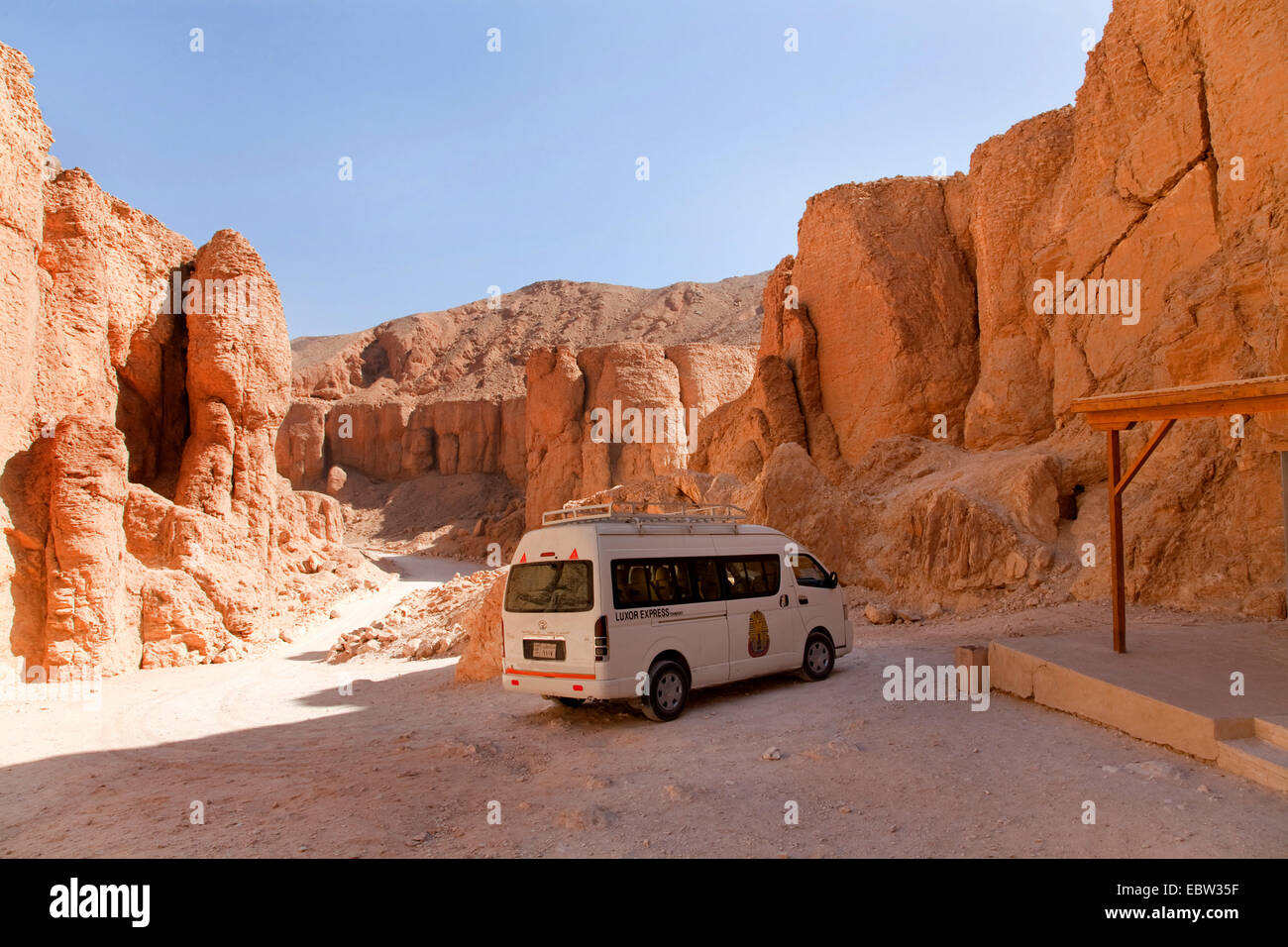 minibus parking in front of the grave of Eje (1323-1319 BC) at the end of the valley of the monkey, Egypt, Tal Der Koenige, Luxor Stock Photo