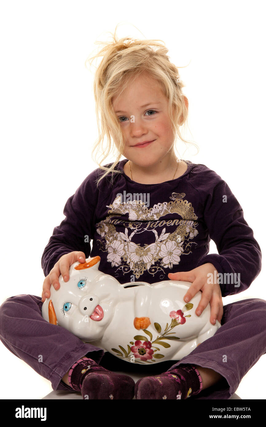 Child with piggy bank Stock Photo