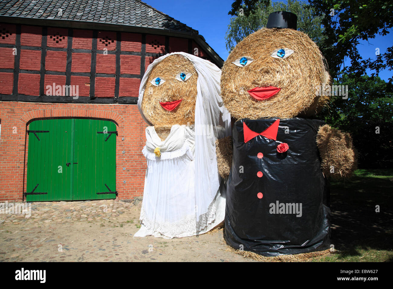Traditional straw dolls made from straw bales, Wendland, Lower Saxony