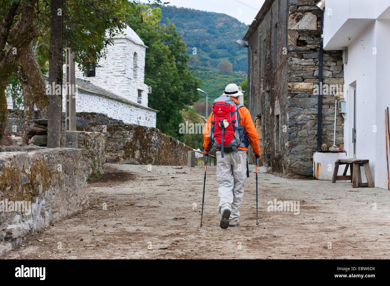 pilgrim on his way through the villge, Spain, Galicia, Lugo, Hospital da Condesa Stock Photo