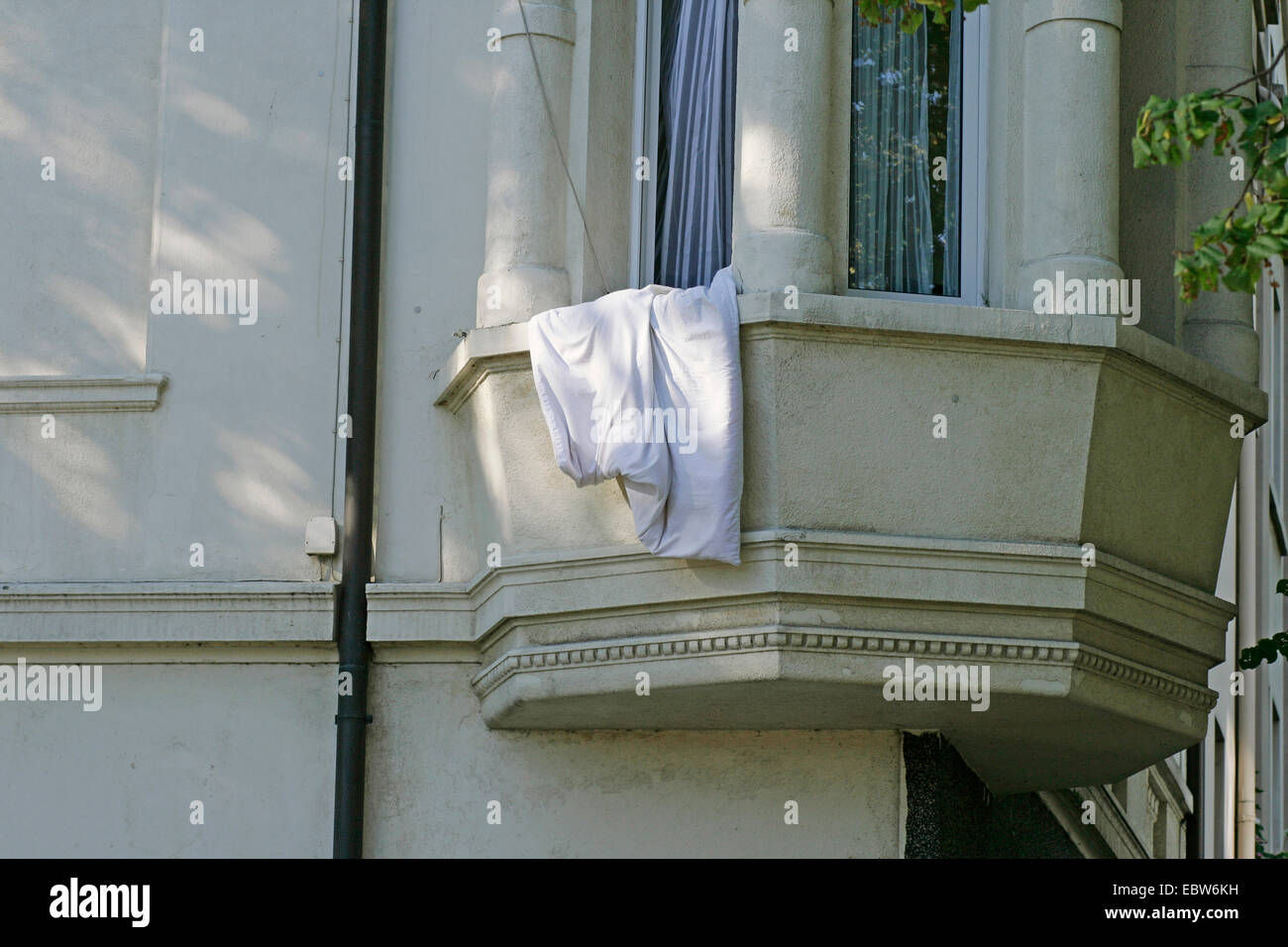 blanket hanging out of a window, Germany Stock Photo Alamy