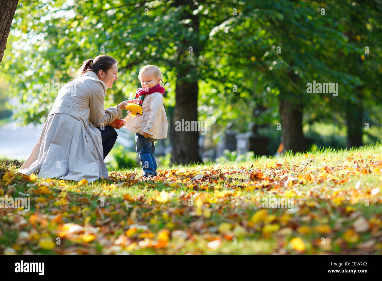 mother and daughter in a park in autumn Stock Photo - Alamy