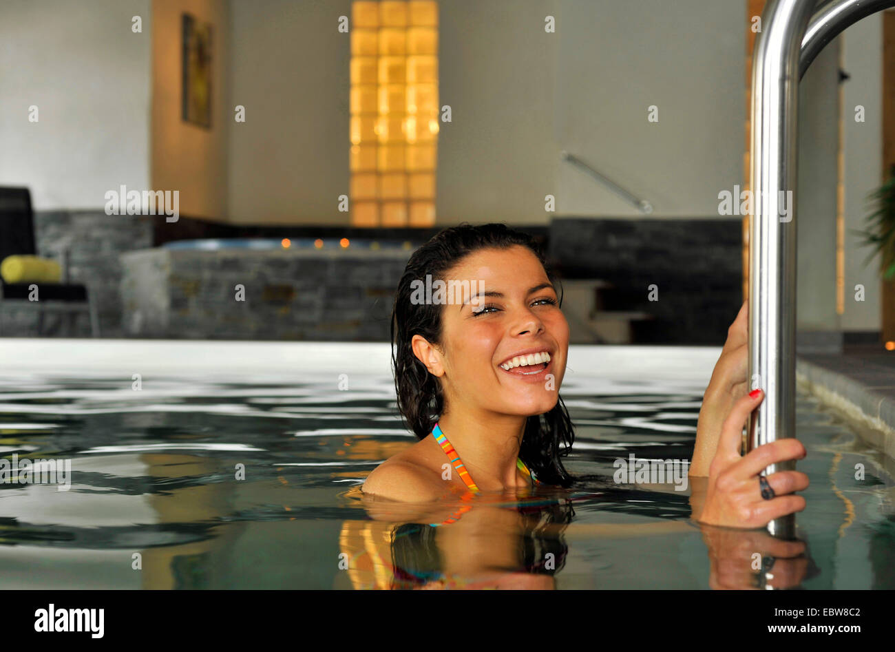 young darkhaired woman in swimming pool Stock Photo