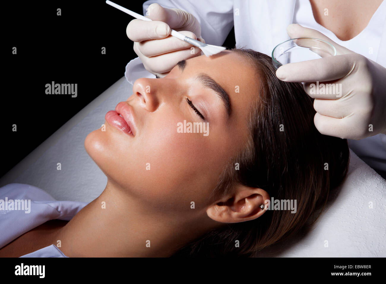 Woman getting a cosmetic skin treatment. Chemical peeling. Stock Photo