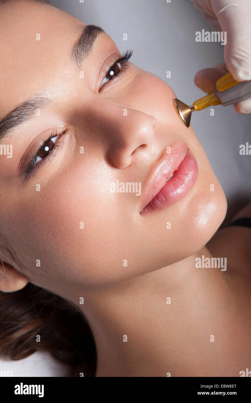 Woman getting a cosmetic skin treatment. Close-up. Stock Photo
