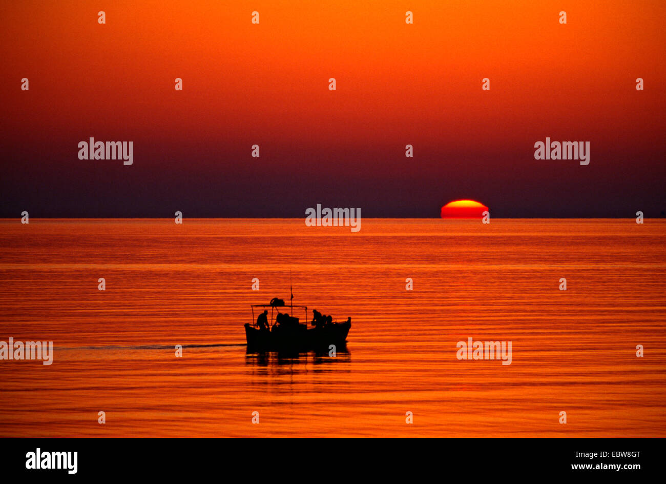 fishing boat at sundawn, Greece, Creta Stock Photo