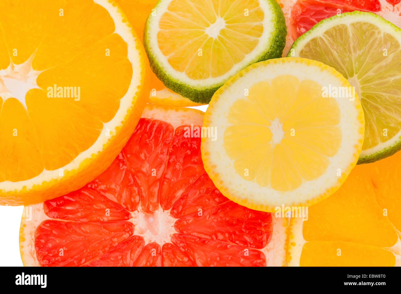 slices of citrus fruits, symbol for healthy vitamins with fresh fruits Stock Photo