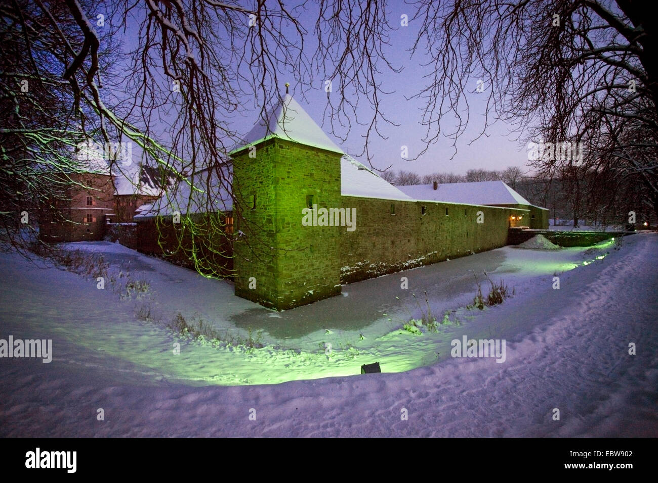 illuminated moated castle Kemnade in winter at blue hour, Germany, North Rhine-Westphalia, Ruhr Area, Hattingen Stock Photo