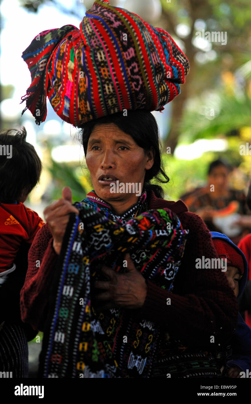 older Maya woman with a bundle on the head on the market, Guatemala, Lake of Atitlan, Solola Stock Photo