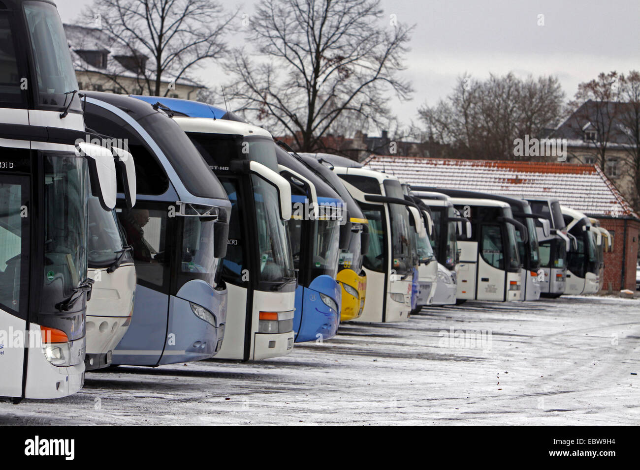 tour buses on a parking place, Germany, North Rhine-Westphalia, Muensterland, Muensterland Stock Photo