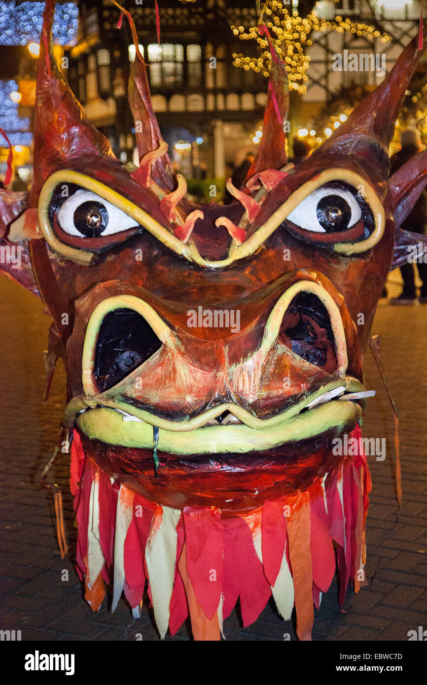 Chester, UK 4th December, 2014. Dragon head at the Mid-Winter Watch Parade from Town Hall Square, down St. Werburgh Street, Eastgate Street, Bridge Street, The Cross and Northgate Street.  Karamba Samba a ‘ghost band’ led a fun parade of skeletons, fire breathing, skeleton Christmas cooks, angels and devils as they celebrated the Winter solstice. An event which dates from the 1400’s, where local artists and community groups join together to celebrate the time when the city leaders would hand over the keys to the city. Stock Photo