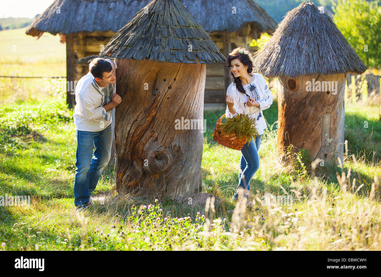 Young couple in Ukrainian style clothing having fun outdoors Stock Photo