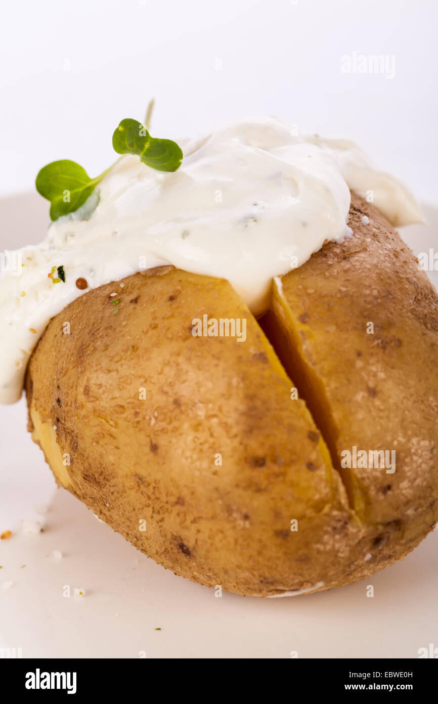 Overhead view of a healthy oven baked jacket potato with sour cream
