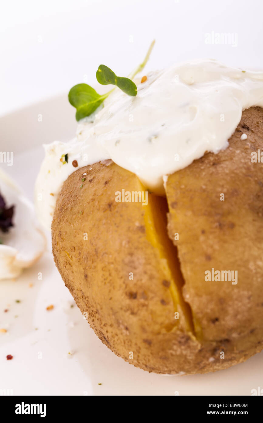 Overhead view of a healthy oven baked jacket potato with sour cream