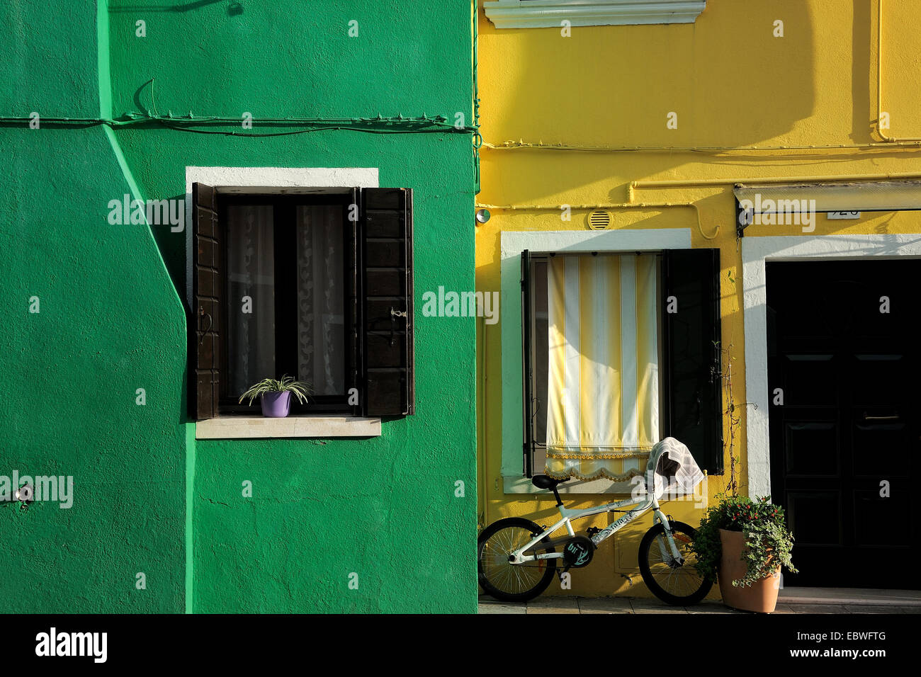 yellow and green house in burano,venice Stock Photo - Alamy