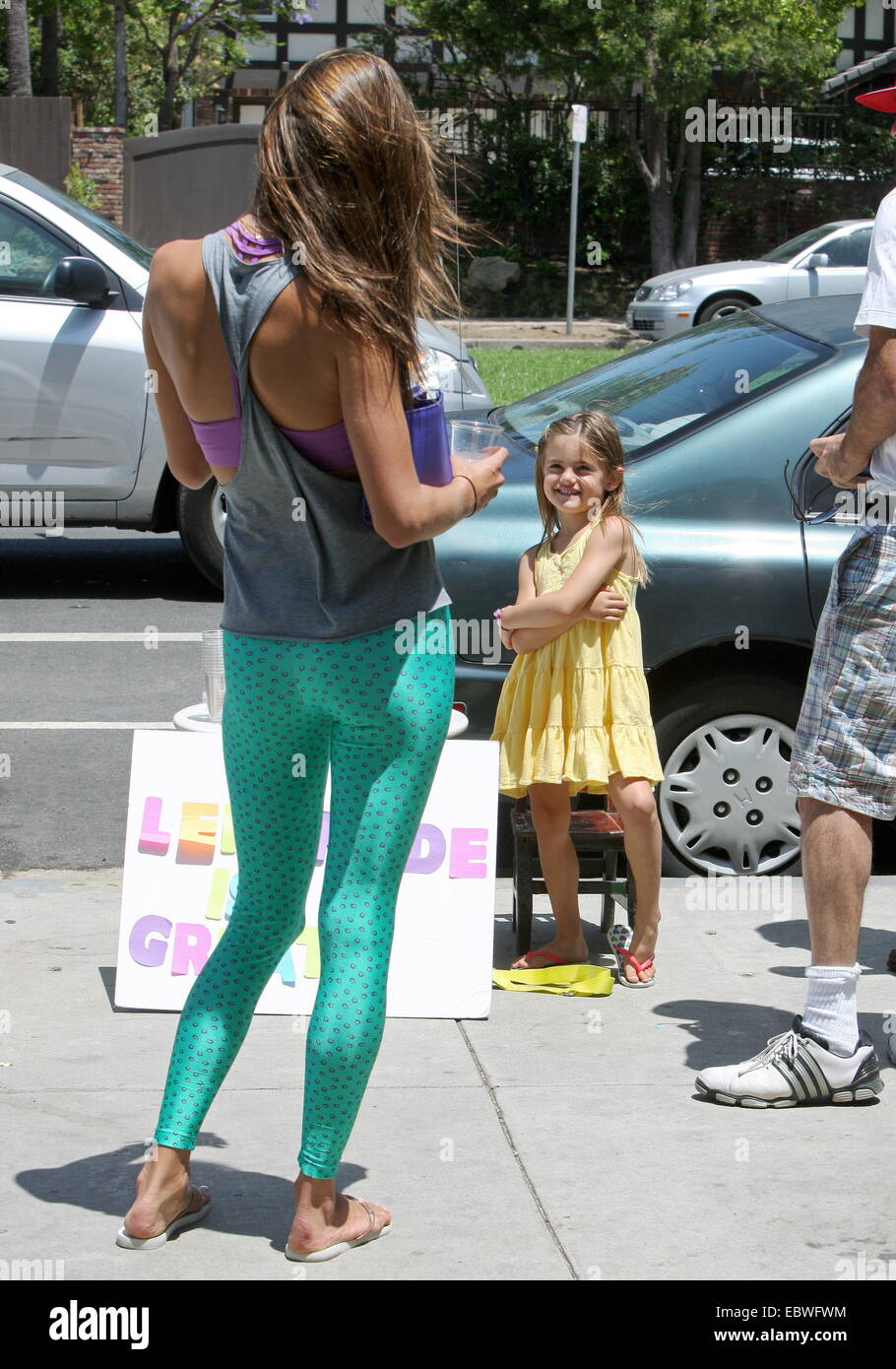 Victoria Secret model, Alessandra Ambrosio wearing a grey vest with  turquoise leggings and matching towel, leaves her gym in Brentwood carrying  her yoga mat Featuring: Alessandra Ambrosio,Anja Mazur Where: Los Angeles,  California,