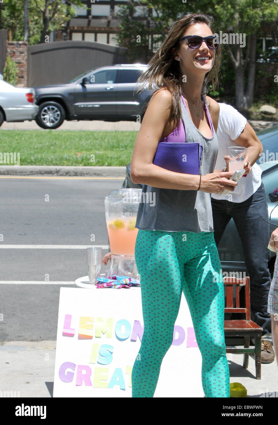 Victoria Secret model, Alessandra Ambrosio wearing a grey vest with  turquoise leggings and matching towel, leaves her gym in Brentwood carrying  her yoga mat Featuring: Alessandra Ambrosio Where: Los Angeles, California,  United
