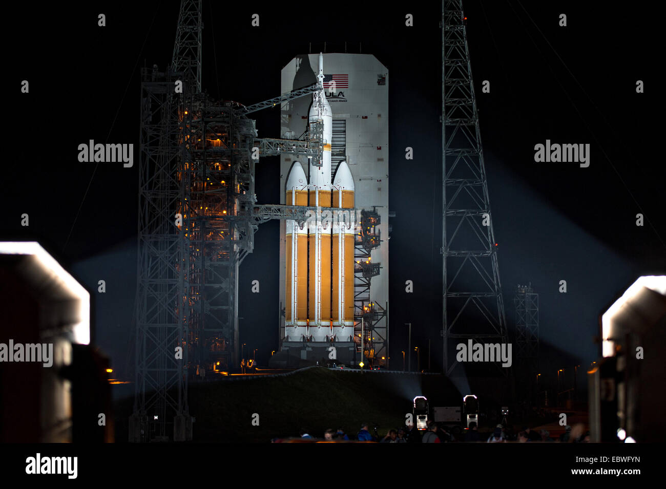 NASA’s Orion spacecraft mounted atop a United Launch Alliance Delta IV Heavy rocket is visible after the Mobile Service Tower rollback in preparation for launch at Space Launch Complex 37 December 4, 2014 in Cape Canaveral, Florida. The launch was scrubbed after a multitude of issues postponed the lift off. Stock Photo