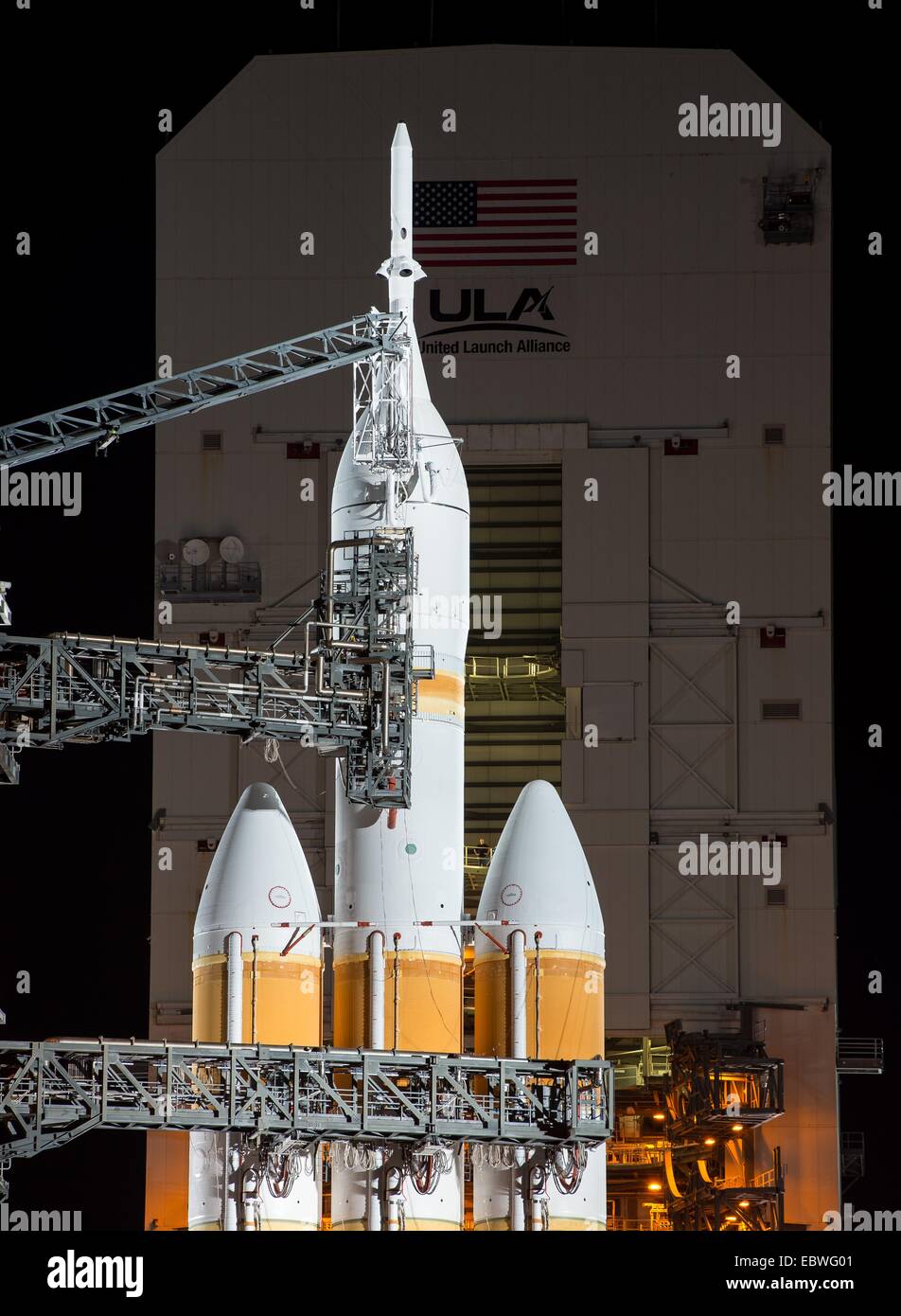 NASA's Orion spacecraft mounted atop a United Launch Alliance Delta IV Heavy rocket is visible after the Mobile Service Tower rollback in preparation for launch at Space Launch Complex 37 December 4, 2014 in Cape Canaveral, Florida. The launch was scrubbed after a multitude of issues postponed the lift off. Stock Photo