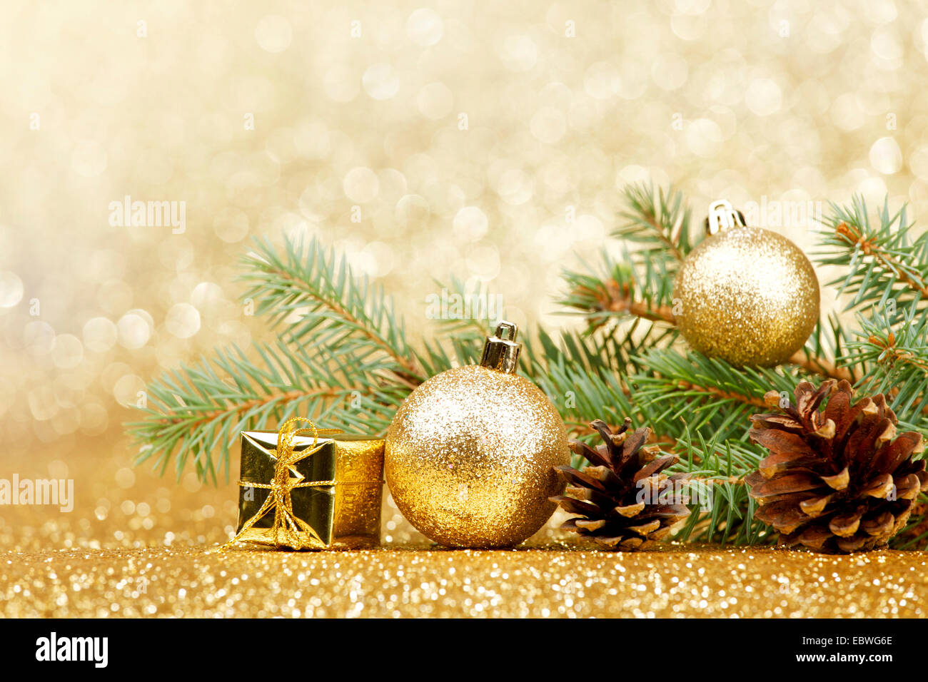 Christmas card with fir and decor on glitter background Stock Photo - Alamy