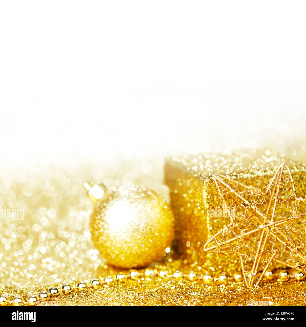 Golden christmas decor and gift on glitter background with white copy ...
