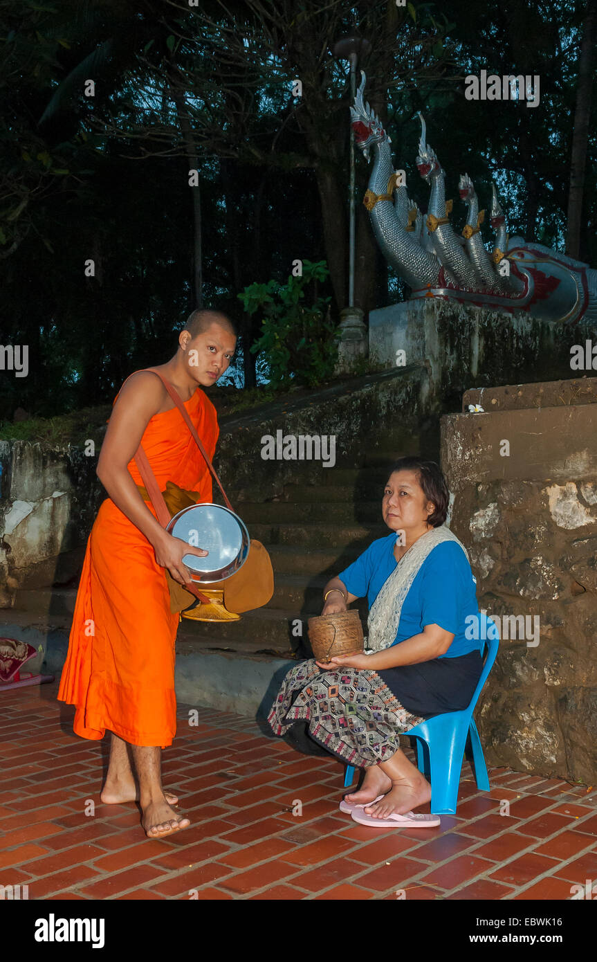 Giving Alms to Monk, Luang Prabang, Laos Stock Photo