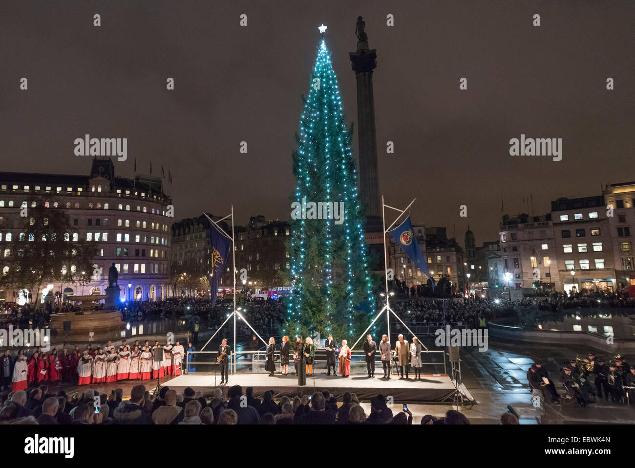 London, UK. 4th December, 2014. The annual lighting of the Trafalgar Square Christmas Tree took place today hosted by the Lord Mayor of Westminster, Cllr Audrey Lewis, who invited the Governing Mayor of Oslo to turn on the Christmas lights. The tree is donated by the City of Oslo to the people of London each year as a token of gratitude for Britain’s support during the Second World War. Pictured: Crowds gather around the Christmas tree in Trafalgar Square. Credit:  Lee Thomas/Alamy Live News Stock Photo