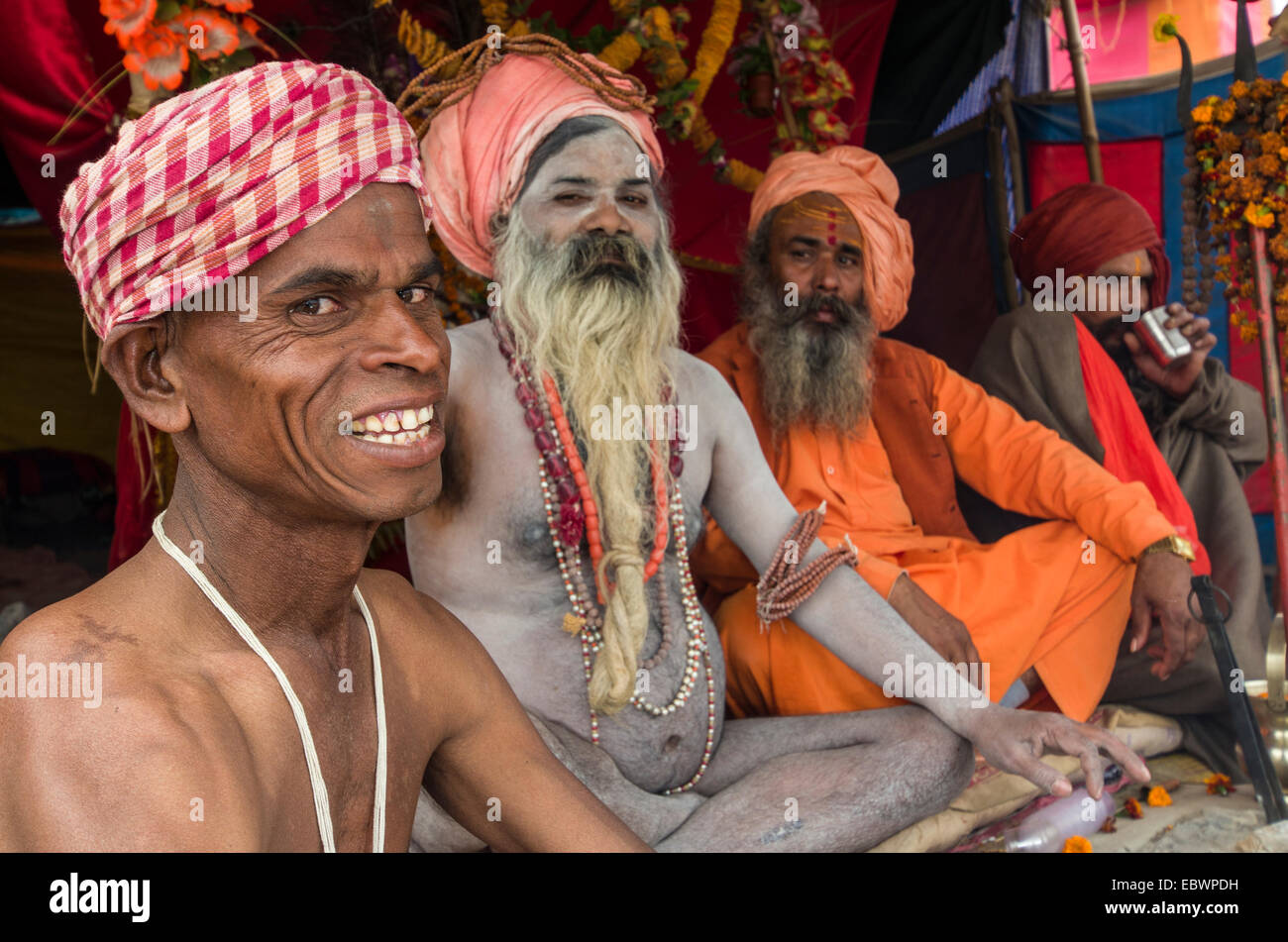 Shiva sadhus, holy men, sitting in a tent at the Sangam, the confluence of the rivers Ganges, Yamuna and Saraswati Stock Photo