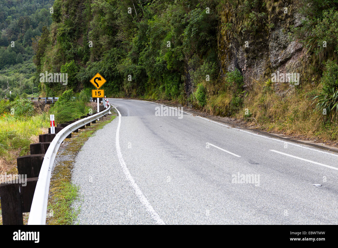 'Dangerous curve' warning sign, road with a dangerous curve, Charleston, West Coast Region, New Zealand Stock Photo