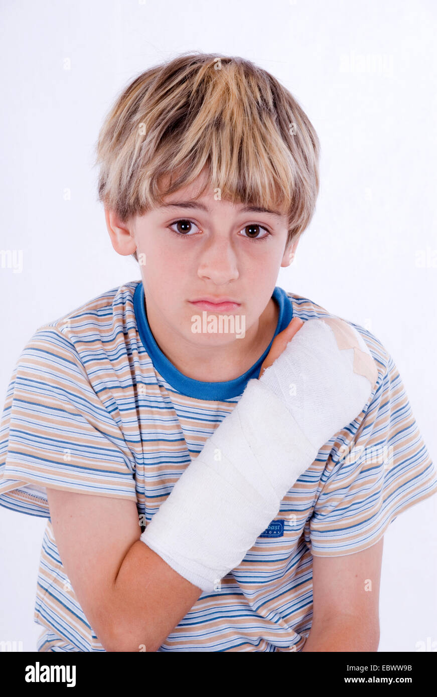 boy with arm in plaster Stock Photo