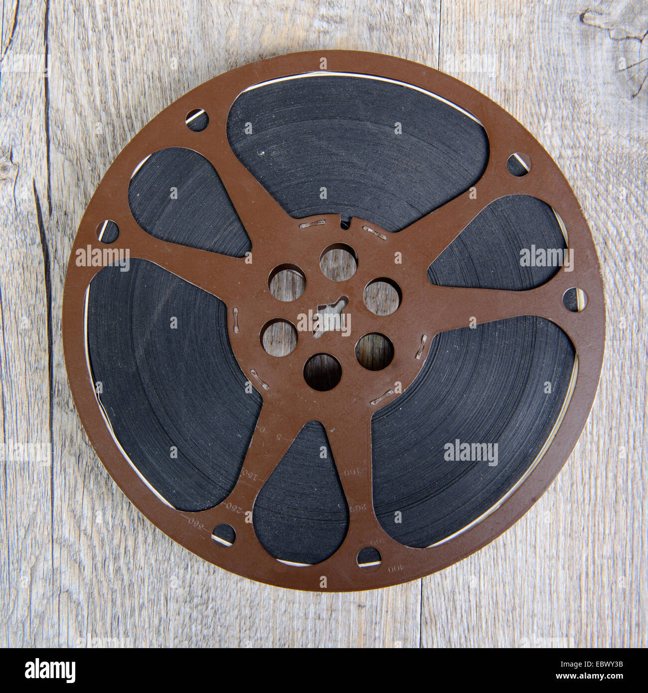 old movie film reel 16mm on the wooden table Stock Photo - Alamy