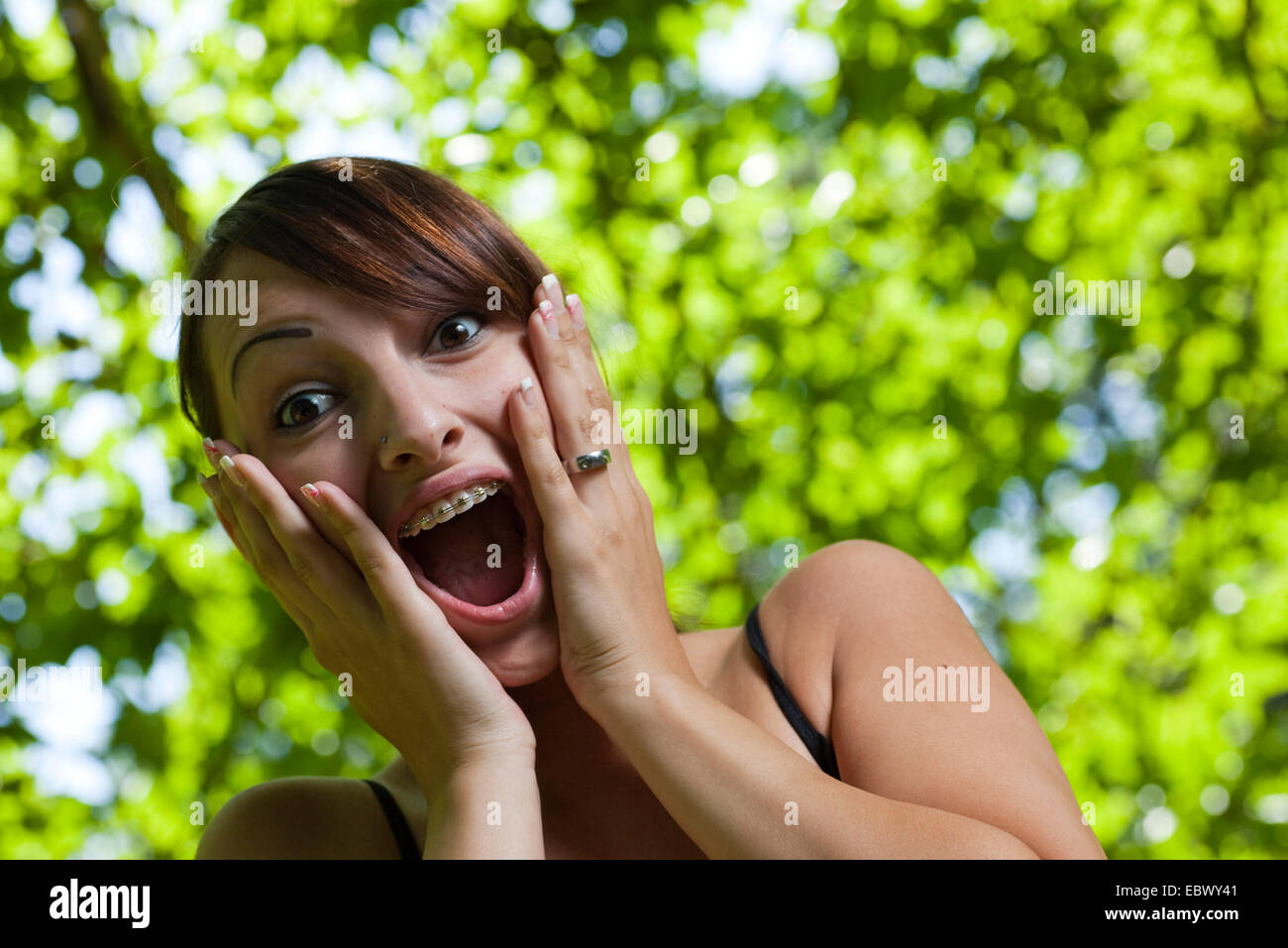 young woman surprised Stock Photo - Alamy