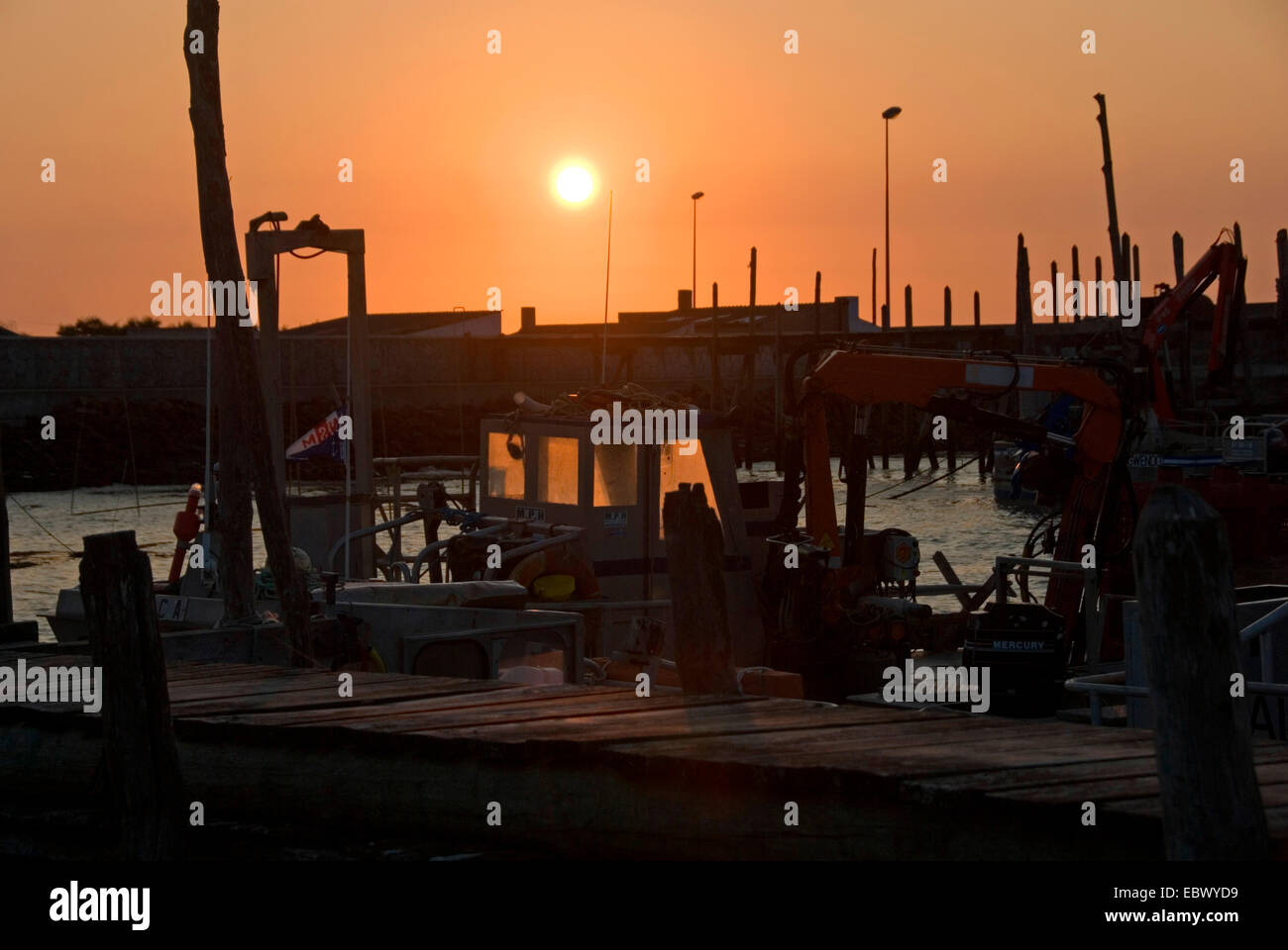 sunset over the little harbour 'Port du Bec' (also called 'Chinese Harbour' for the wooden landing stages)  in the swamp area of Vend�e, France, Vendee, Port du Bec Stock Photo