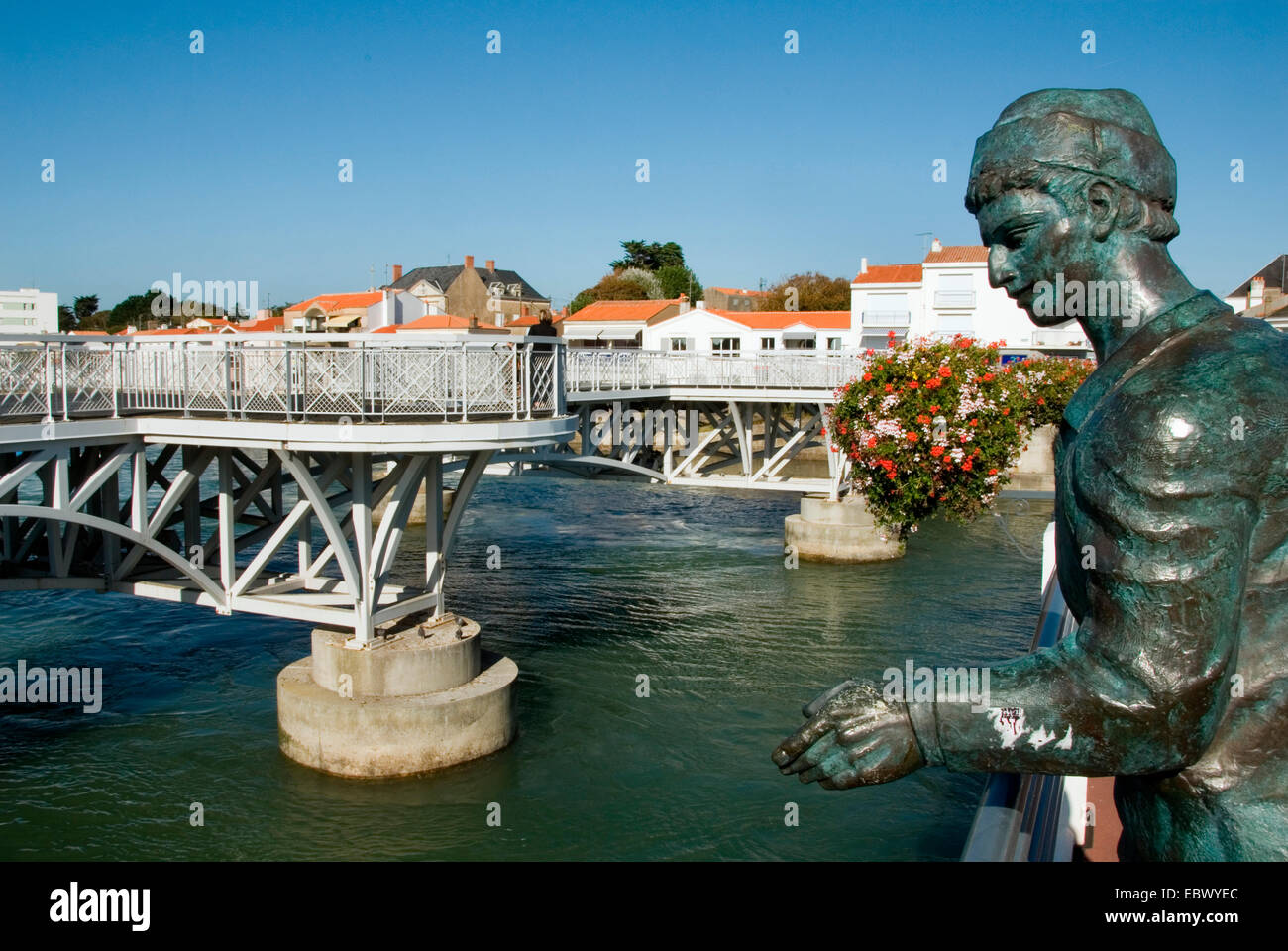 La Vie river with bridge Pont de la Concorde and statue, France, Poitou