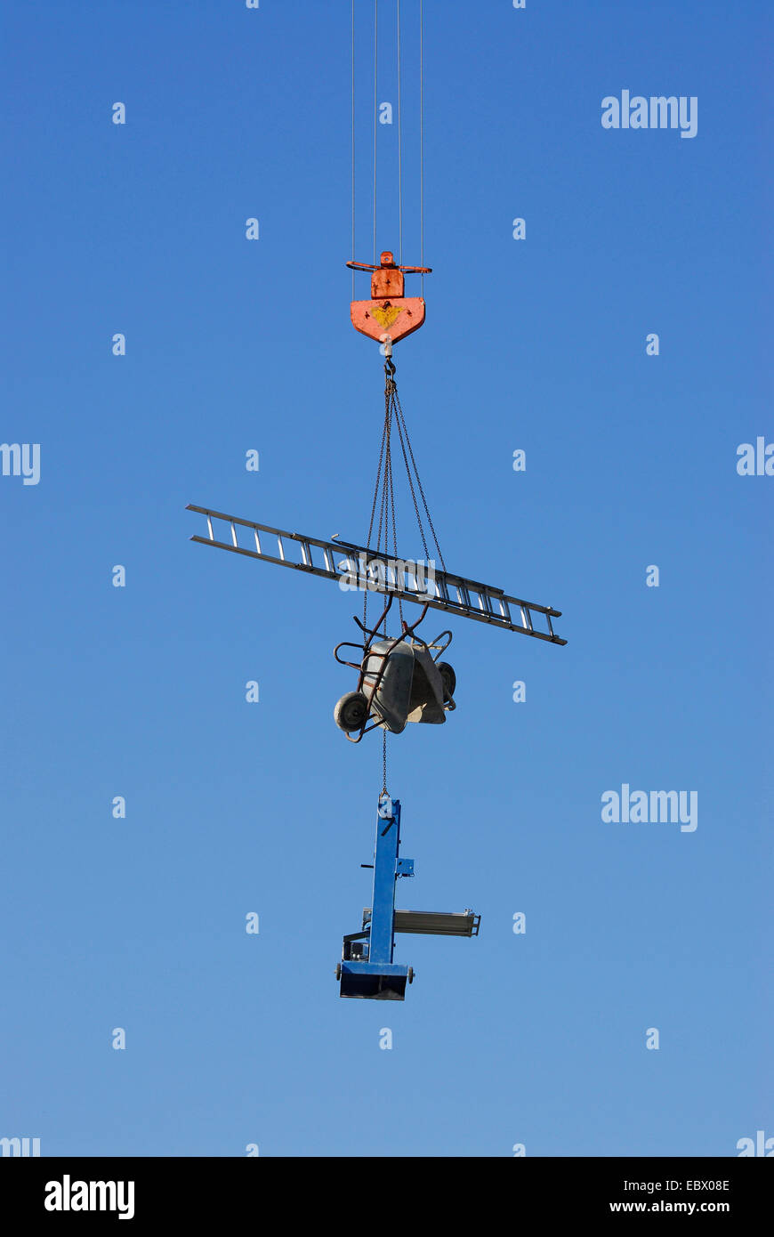 construction equipment transporting by a tower crane, Germany Stock Photo