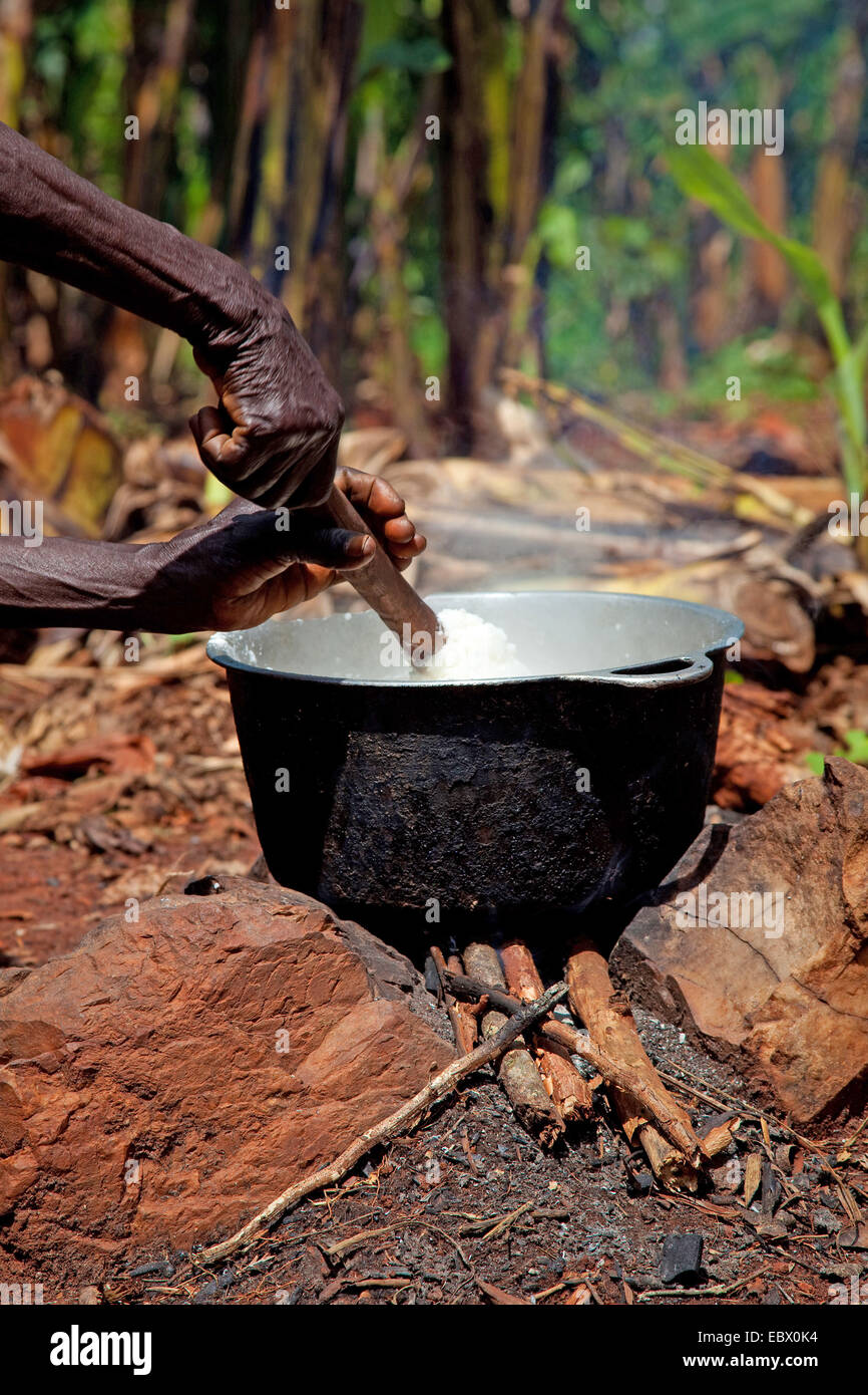 African woman cooking in a large pot, outside Stock Photo - Alamy