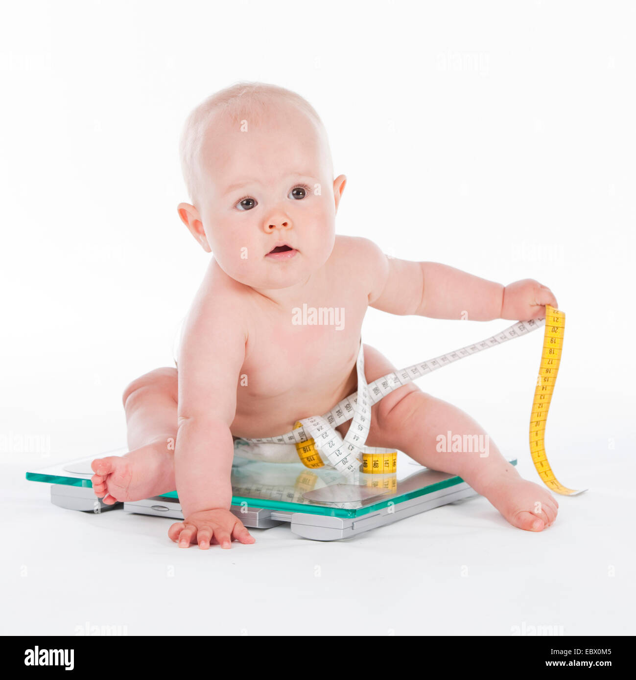10 months old baby on scale Stock Photo Alamy