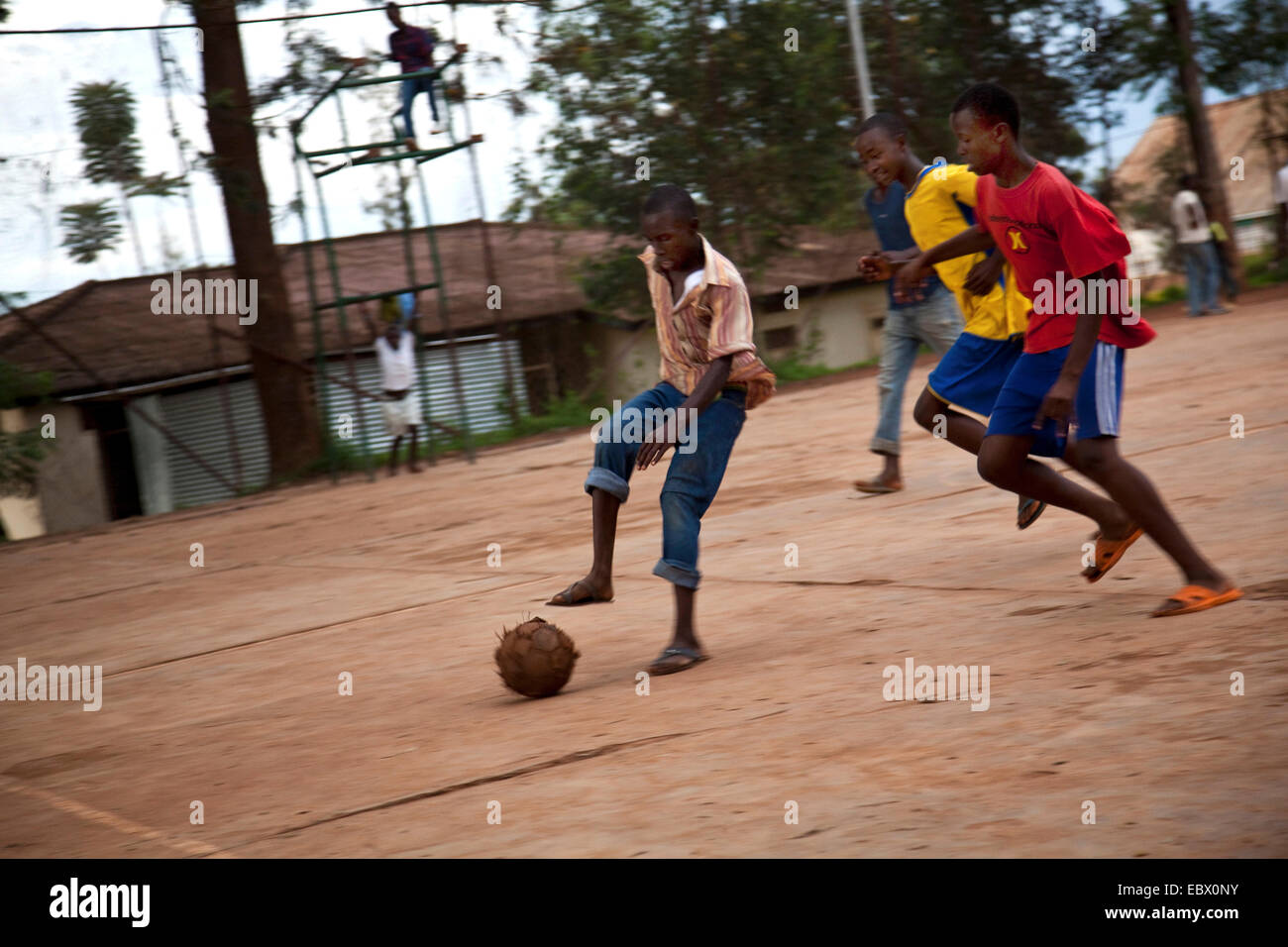 Adolescents playing soccer - football on a concrete area, Rwanda, Nyamirambo, Kigali Stock Photo