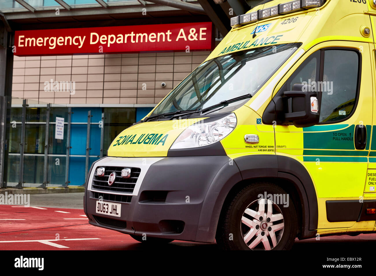 NHS Ambulances wait outside the QE Hospital Birmingham Accident and Emergency department or A&E dept. West Midlands Ambulance. Stock Photo