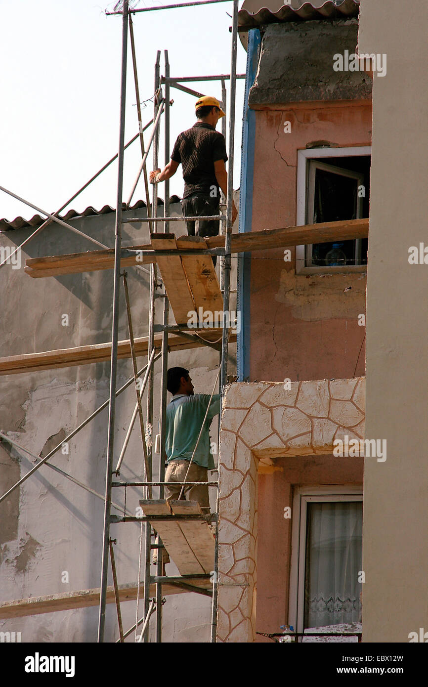 working man at a facade, Turkey, Istanbul Stock Photo