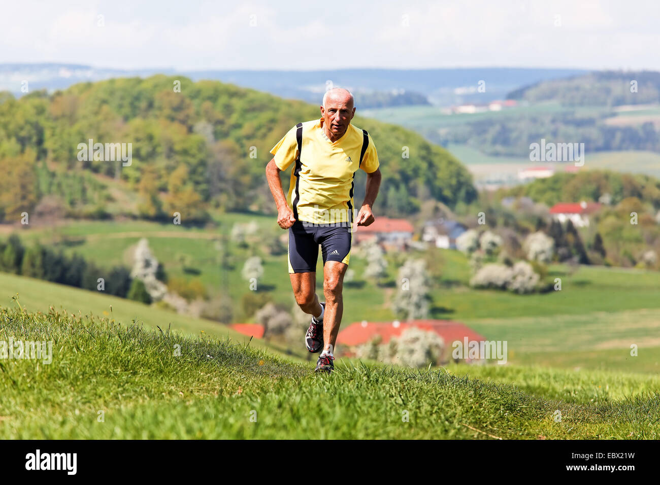 Elderly jogger training for his fitness jogging Stock Photo