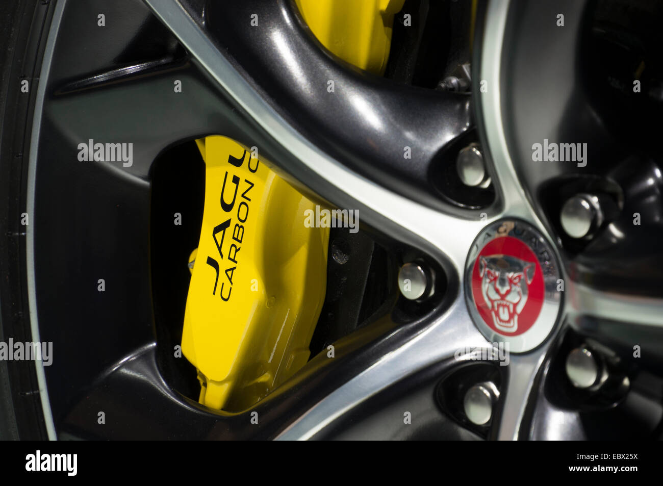 detail of Jaguar wheel with yellow carbon brake assembly, Jaguar logo