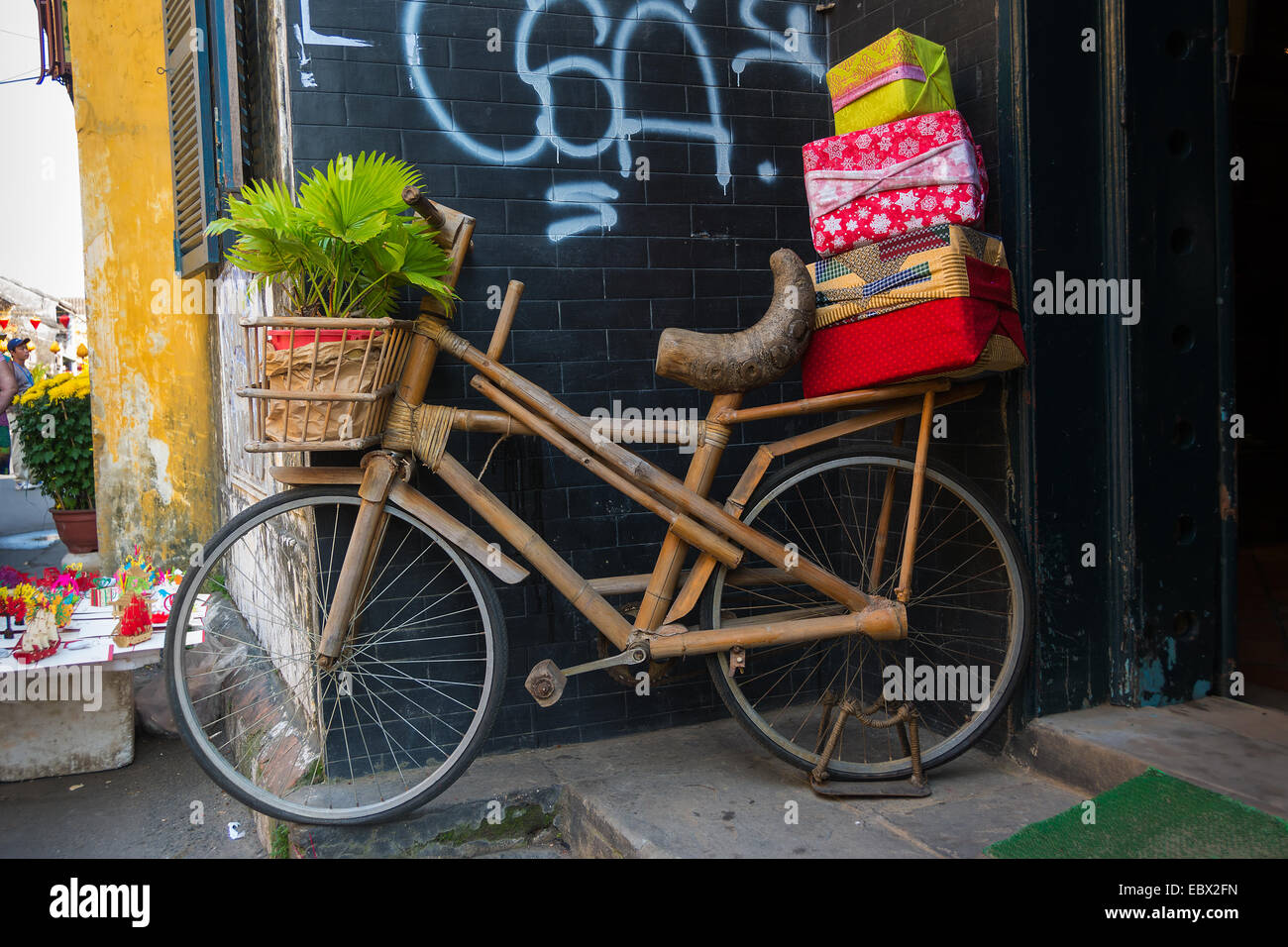 Handmade bamboo bicycle with gift wrapped parcels Stock Photo