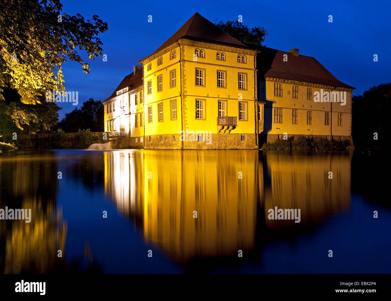 illuminated moasted castle at blue hour, Germany, North Rhine-Westphalia, Ruhr Area, Herne Stock Photo