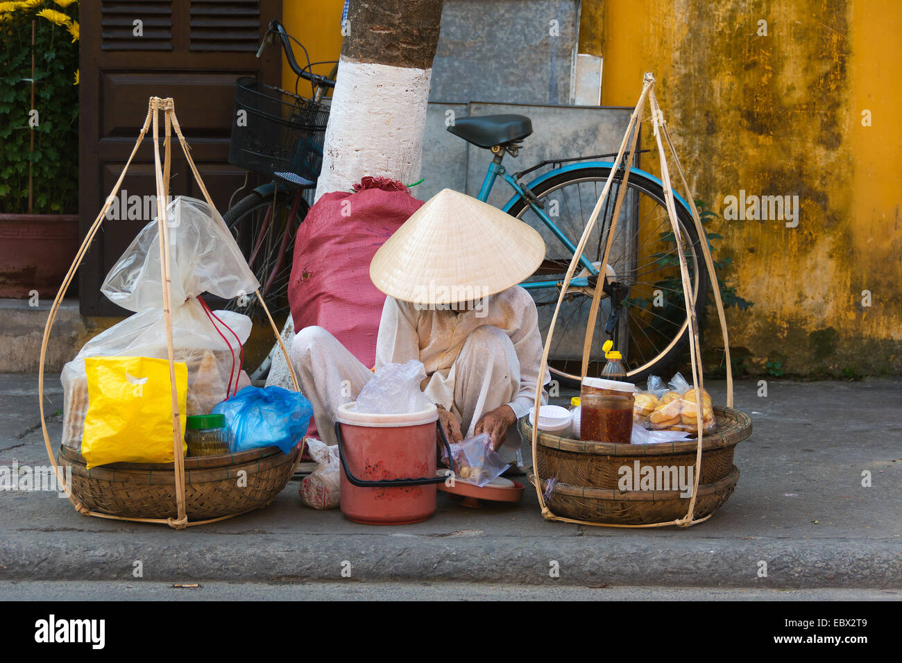 Vietnamese woman preparing food for sale on the street Stock Photo