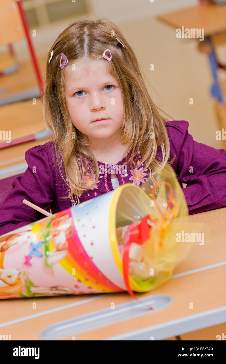 child starting school with school cone in classroom Stock Photo