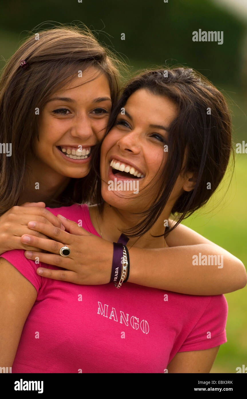 portrait of two smiling 15 year old girls, France Stock Photo